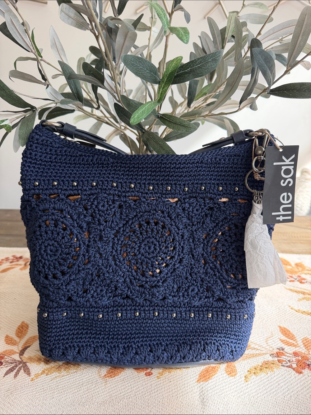 The Sak Sequoia Navy Crochet Shoulder Bag with Tassel Charm